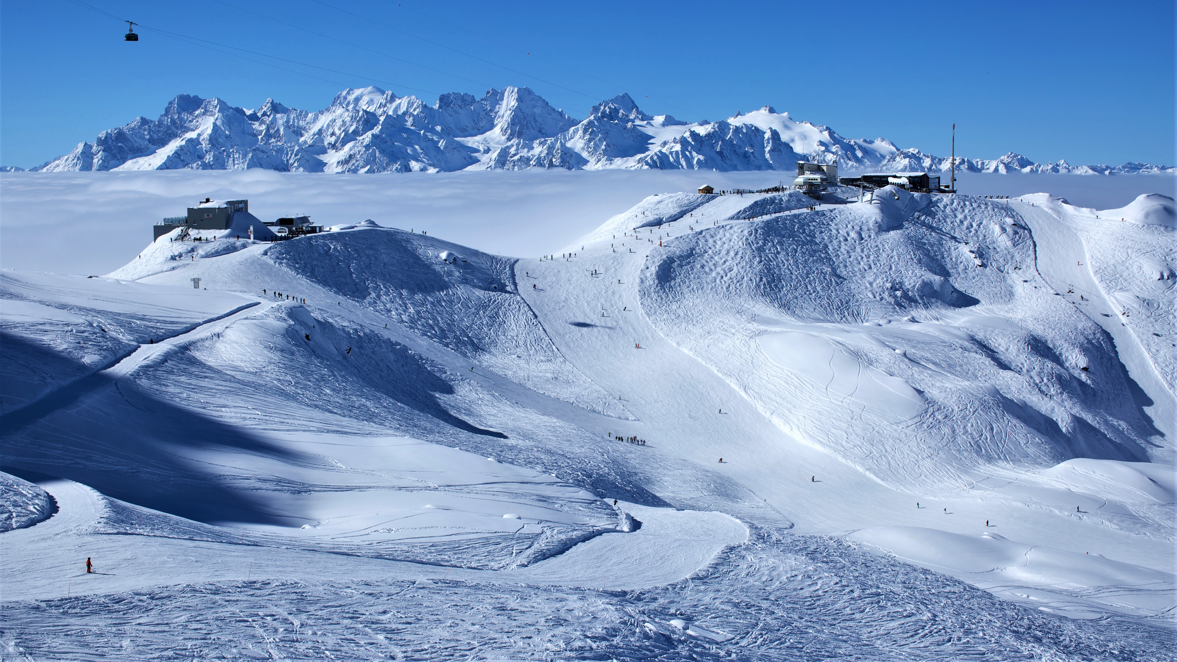 Cable car station on the top of swiss mountains with mont blanc on the background